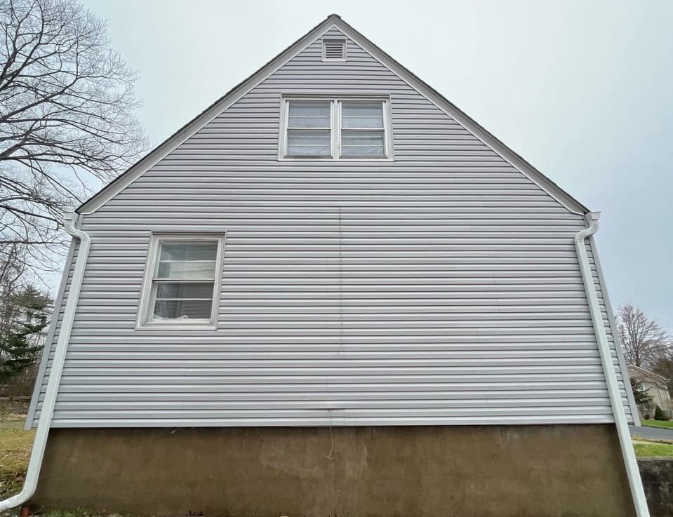 Cuyahoga Falls Power Washing technician performing detailed house washing in Cuyahoga Falls residential area